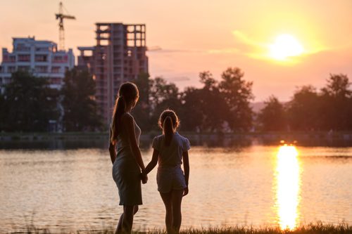 Survivor and daughter watch sunset